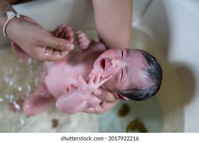 Portrait of baby taking a hygiene bath on the bathtub.Selective focus on baby. - Shutterstock ID 2017922216