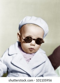 Portrait Of Baby Wearing Beret And Sunglasses