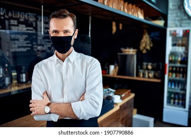 Portrait Of Barista Restaurant Owner Wearing Mask Standing In Cafe