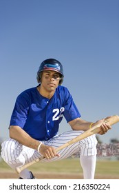 Portrait Of Baseball Player Holding Bat