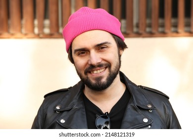 Portrait Of Beard Hipster Man Posing In Leather Jacket And Beanie Hat.