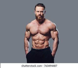 Portrait of bearded shirtless bodybuilder.