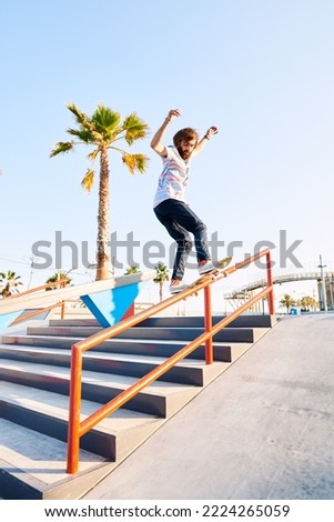 Image, Stock Photo Young bearded skater performing trick in skatepark