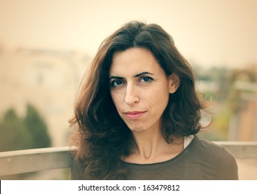 Portrait of beautiful 35 years old woman outdoors