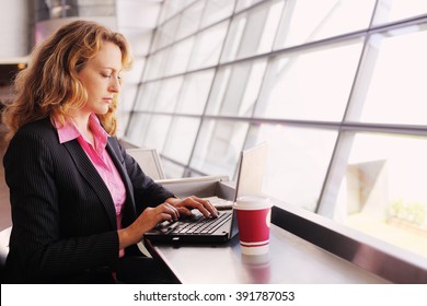 Portrait of beautiful 35 years old woman with laptop