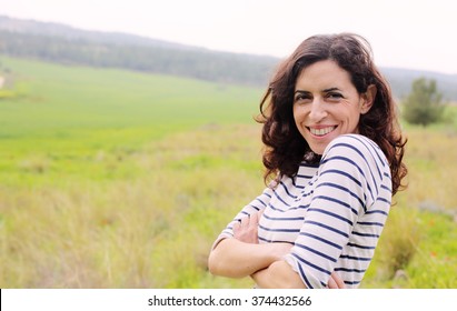 Portrait of beautiful 40 years old woman outdoors