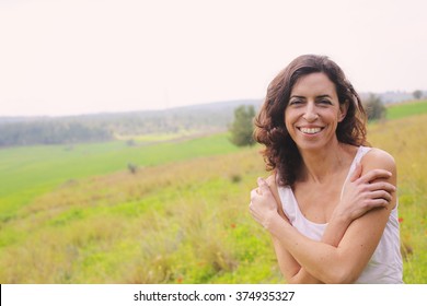 Portrait of beautiful 40 years old woman outdoors