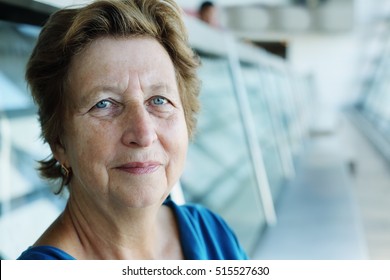 Portrait Of Beautiful 70 Years Old Woman Sitting In The Indoor Cafe