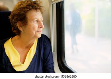 Portrait Of Beautiful 70 Years Old Woman Sitting In The Train

