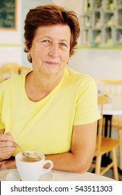 Portrait Of Beautiful 70 Years Old Woman Drinking Morning Coffee