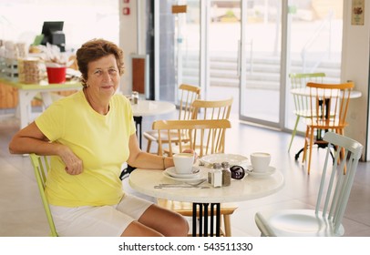 Portrait Of Beautiful 70 Years Old Woman Drinking Morning Coffee