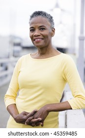 Portrait of a Beautiful African American Woman Standing on a Wharf