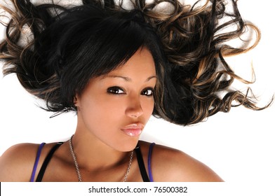 Portrait of beautiful African American woman laying over white background