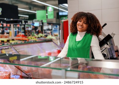 Portrait of beautiful  African American worker smiling in grocery store. - Powered by Shutterstock