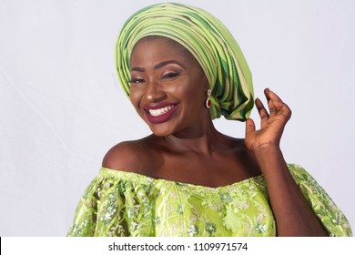 Portrait Of Beautiful African Woman In Green Traditional Dress