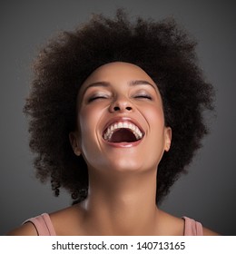 Portrait Of A Beautiful African Woman Laughing.