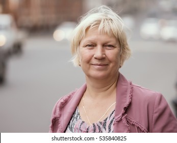 Portrait Of Beautiful Aged Woman In The Street. Selective Soft Focus On Eyes.