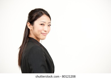 Portrait Of Beautiful Asian Businesswoman Turning Round