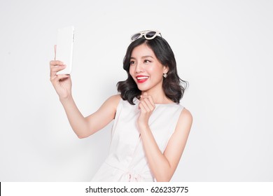 Portrait Of Beautiful Asian Fashionable Girl Taking Selfie