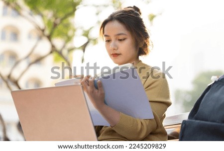 Portrait of a beautiful Asian female student at university