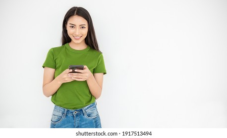 Portrait Of Beautiful Asian Japanese Trendy Business Girl Celebrate With Smart Phone With Copy Space On White Background. Success And Happy Woman Education Internet Technology Startup Business. 