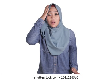 Portrait of beautiful Asian muslim woman wearing hijab shocked worried with mouth opened, isolated on white