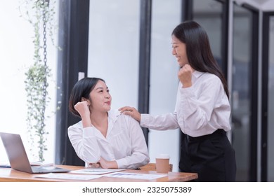 Portrait of a beautiful Asian teenage girl using computer for conferencing at the office. - Shutterstock ID 2325075389
