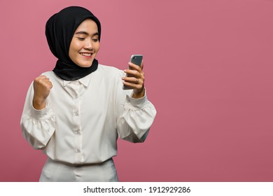 Portrait of beautiful Asian woman cheerful and holding smartphone