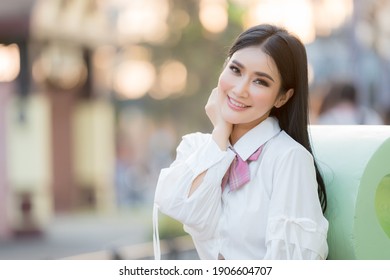 Portrait beautiful asian woman lifestyle resting in the park, relaxation concept, mind care