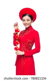 Portrait of a beautiful Asian woman on traditional festival costume Ao Dai. Tet holiday. Lunar New Year.