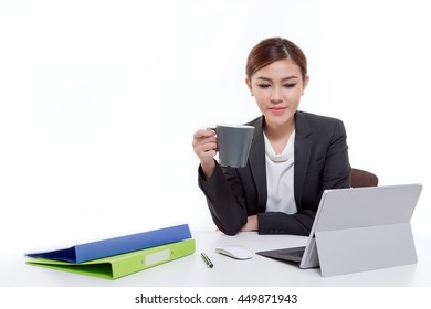 Portrait Beautiful Asian Woman Using Laptop , Document And Computer On The Table, Holding Coffee Cup.