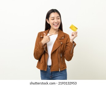 Portrait Beautiful Asian Women In Jacket Fashion Jean Standing Pose Holding Credit Card To Shopping Payment. Attractive Happy Businesswoman With Creditcard.