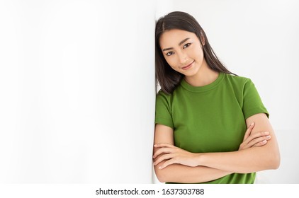 Portrait Of Beautiful Asian Young Girl Leaning Wall With Copy Space Isolated On White Background. Positive Happy Beauty Woman, New Generation Young Power People Business Education Successful Concept 