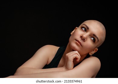 Portrait Of A Beautiful Bald Woman. Studio Shot On Dark Background