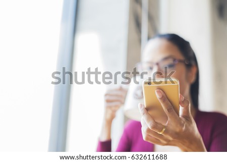 Portrait of beautiful black hair Business woman with a cup coffee. Young Influencer millennial Using Social Media on Smartphone, Like, Follower, Comment and share on social.