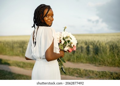 Portrait Of Beautiful Black Woman With Flowers