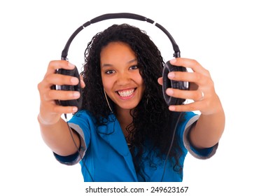 Portrait Of A Beautiful Black Woman With Headphones Listening To Music Isolated