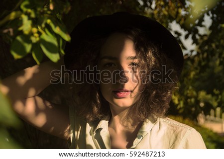 Similar – barefoot young woman sitting barefoot in a window frame