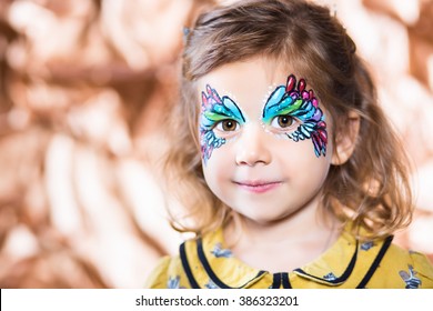 Portrait Of Beautiful Blond Girl With Painted Face