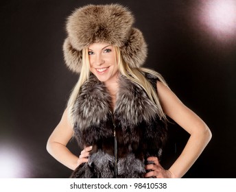 Portrait Of A Beautiful Blond Woman Wearing Fur Coat And Hat