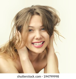 Portrait of a beautiful blonde girl smiling. Attractive young happy woman with long hair - Shutterstock ID 194799998