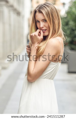 Similar – Image, Stock Photo Smiling young woman in urban background