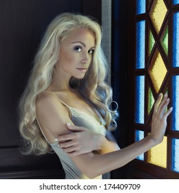 Portrait Of Beautiful Blonde Princess In Stained Window