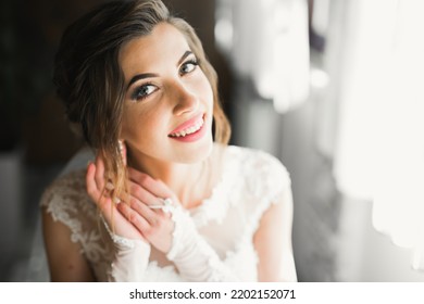 Portrait Of Beautiful Bride With Fashion Veil At Wedding Morning