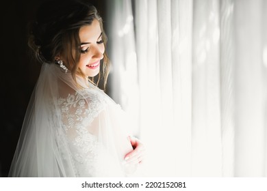 Portrait Of Beautiful Bride With Fashion Veil At Wedding Morning