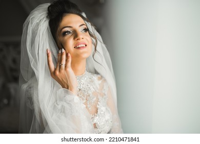 Portrait Of Beautiful Bride With Fashion Veil At Wedding Morning