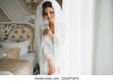 Portrait Of Beautiful Bride With Fashion Veil At Wedding Morning