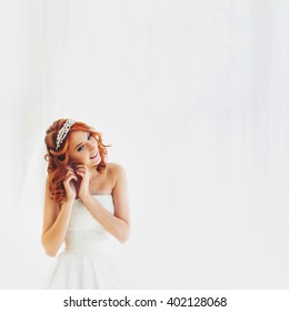 Portrait Of The Beautiful Bride On The White Background