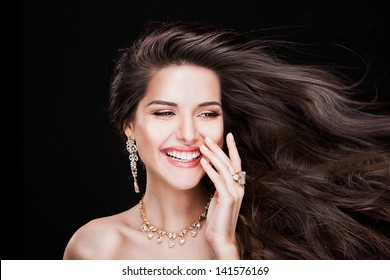 portrait of a beautiful brunette girl with luxury accessories.Beauty with jewellery. happy fashion model