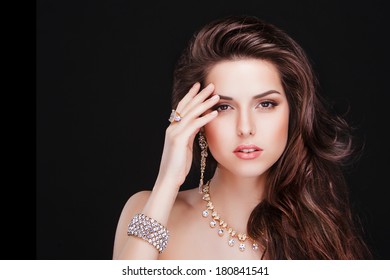 Portrait Of A Beautiful Brunette Girl With Luxury Accessories.Beauty With Jewellery. Fashion Model 